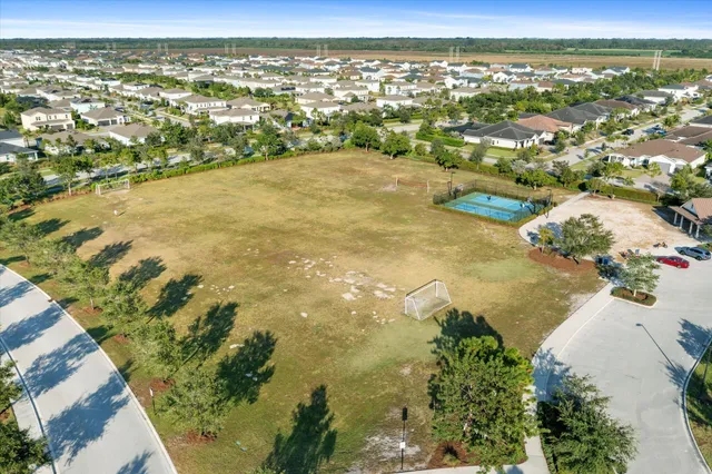 a view of a lake with chairs