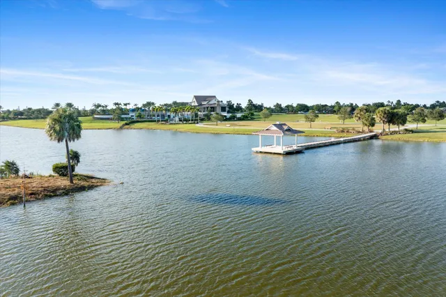 a view of a swimming pool with a yard