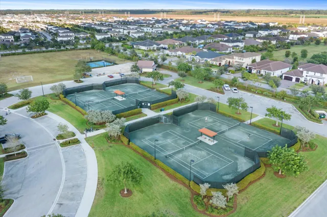 a view of swimming pool with outdoor seating and plants