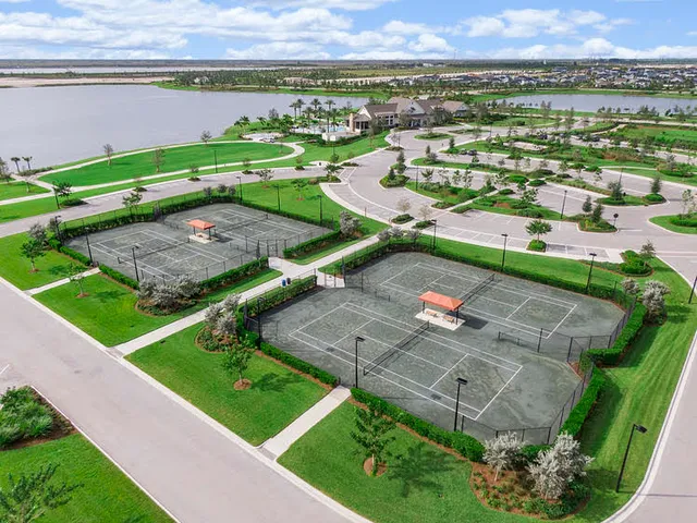 a living room with lots of furniture and kitchen view