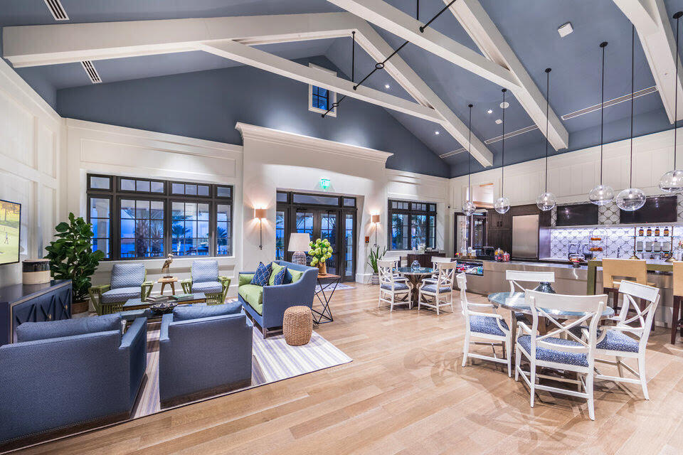 1346 Harvester Crossing Loxahatchee, FL 33470 - Photo 41 of 43 a living room with lots of furniture and kitchen view