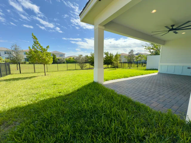 a view of an empty room with a big yard