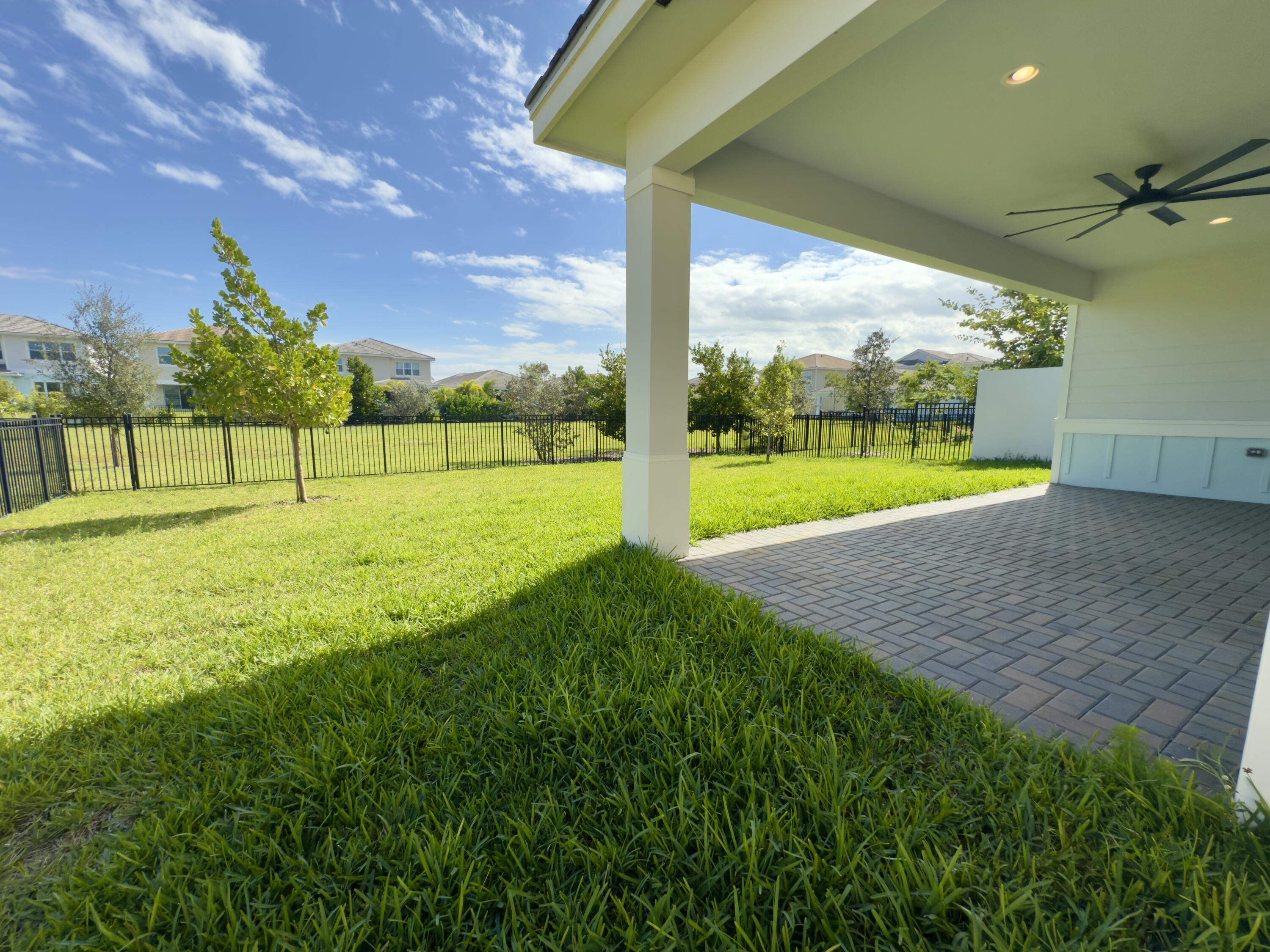 1346 Harvester Crossing Loxahatchee, FL 33470 - Photo 6 of 43 a view of an empty room with a big yard