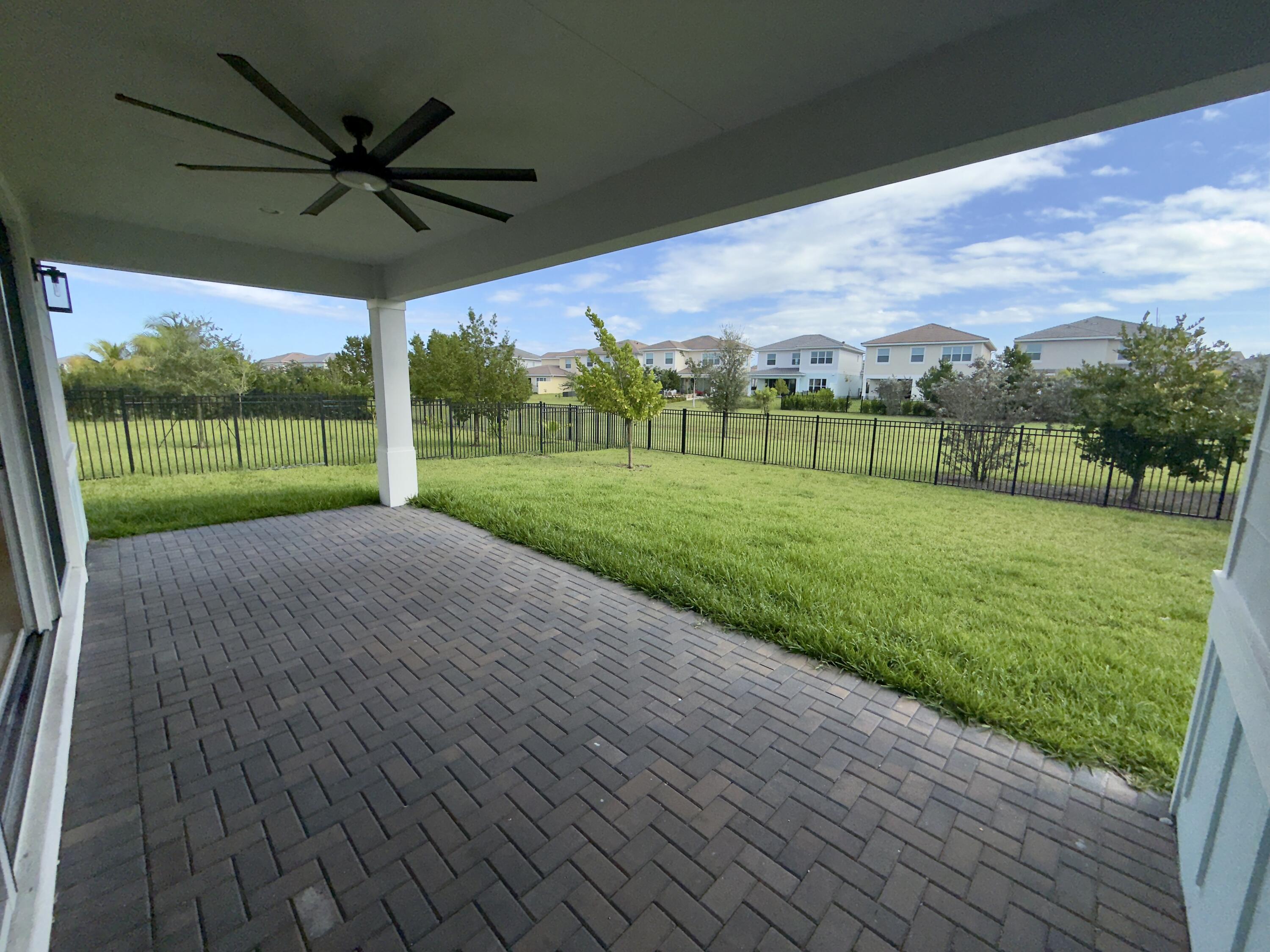 1346 Harvester Crossing Loxahatchee, FL 33470 - Photo 7 of 43 a view of a house with a big yard