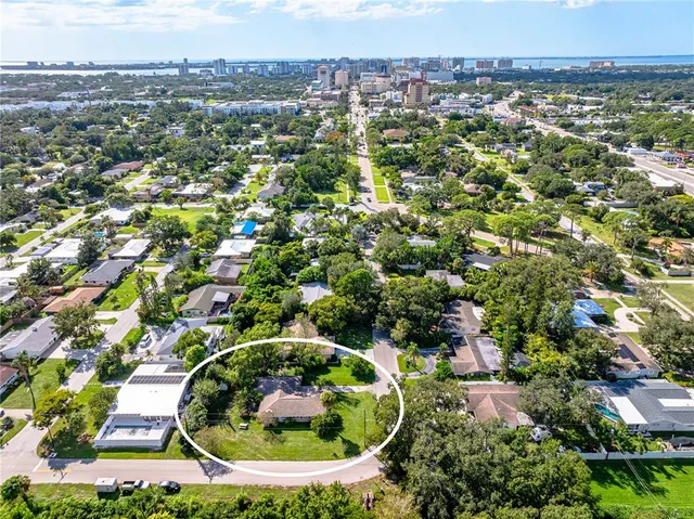 an aerial view of a residential houses and outdoor space