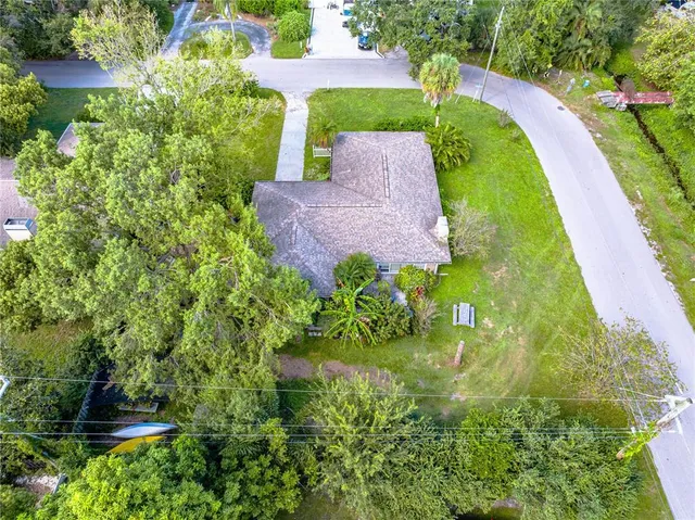 a aerial view of a house with a yard