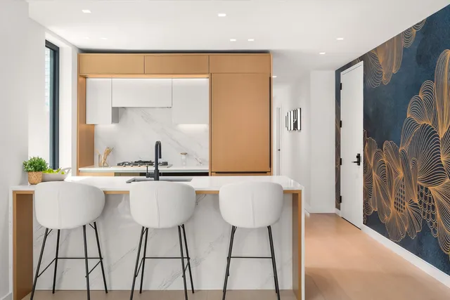 a kitchen with a table and chairs in it