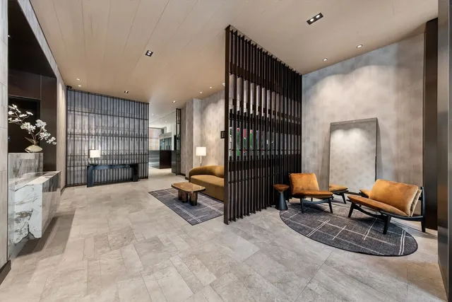 a view of a backyard with table and chairs