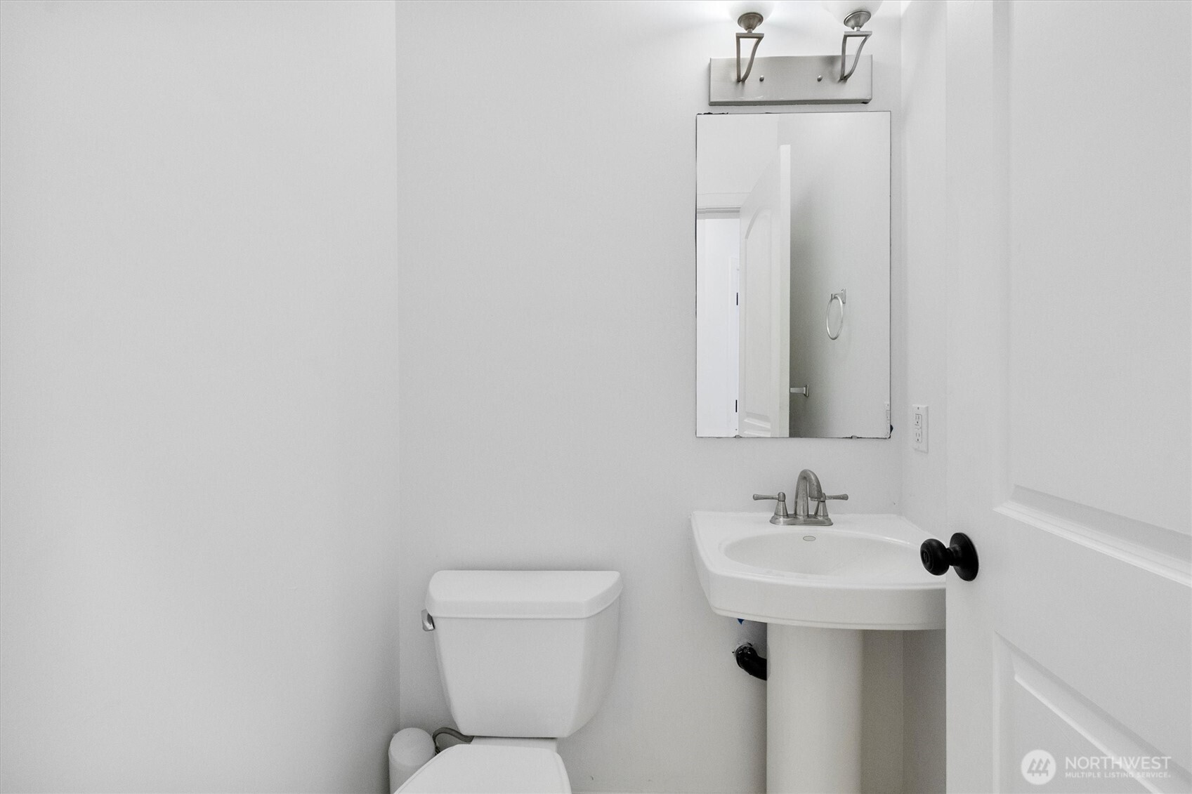 4169 Dover Street Bellingham, WA 98226 - Photo 16 of 31 a bathroom with a sink mirror and toilet