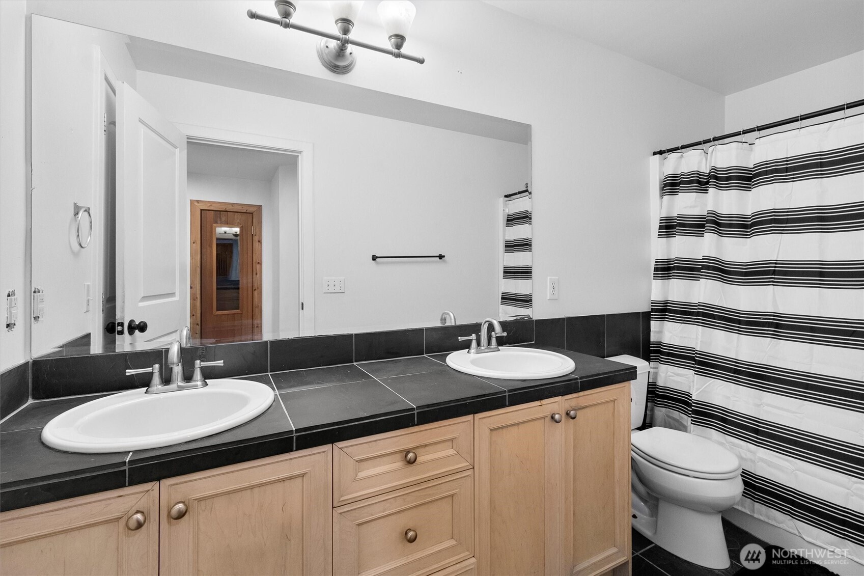 4169 Dover Street Bellingham, WA 98226 - Photo 21 of 31 a bathroom with a granite countertop sink and a mirror