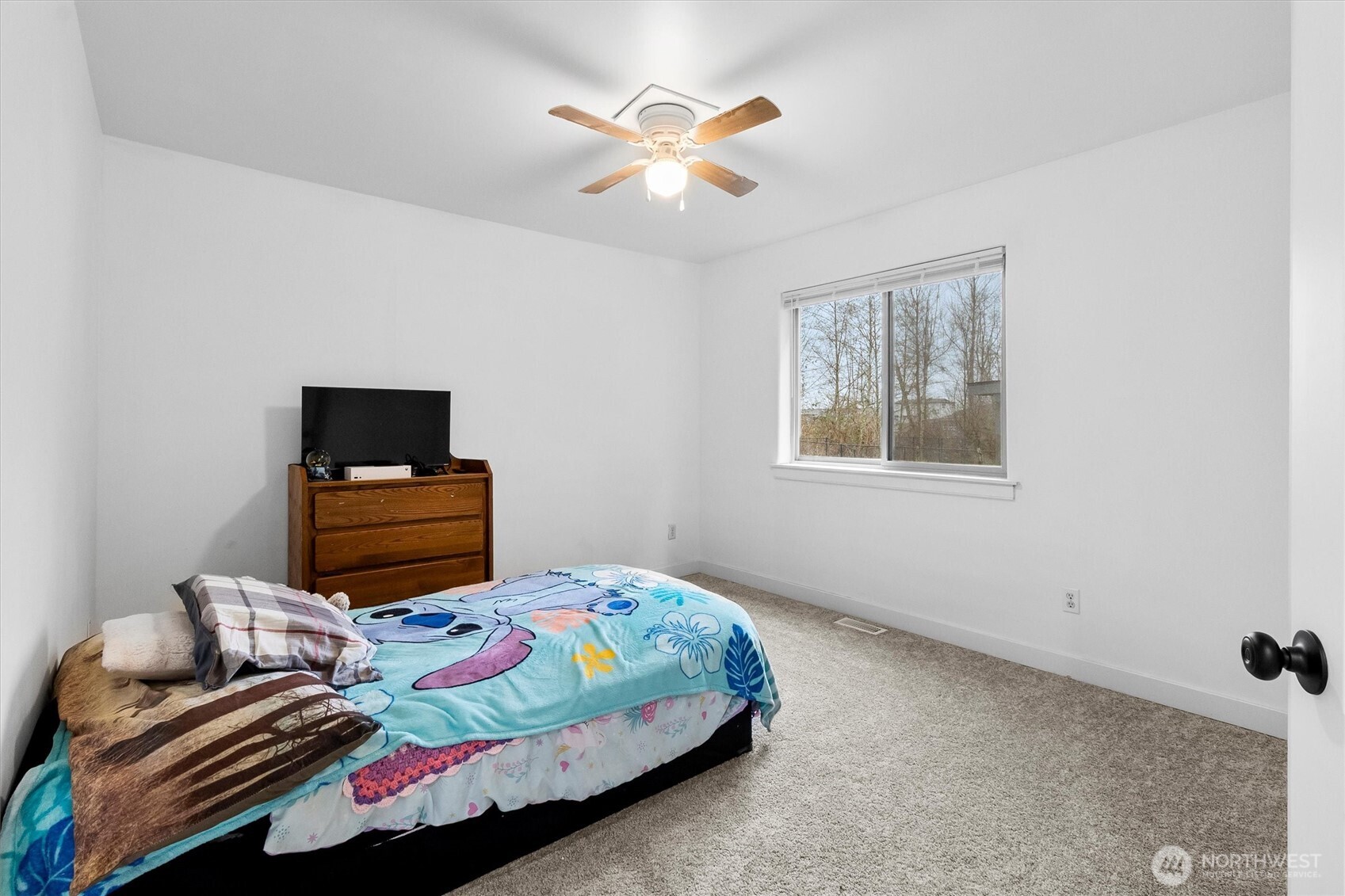 4169 Dover Street Bellingham, WA 98226 - Photo 30 of 31 a bedroom with bed and a ceiling fan