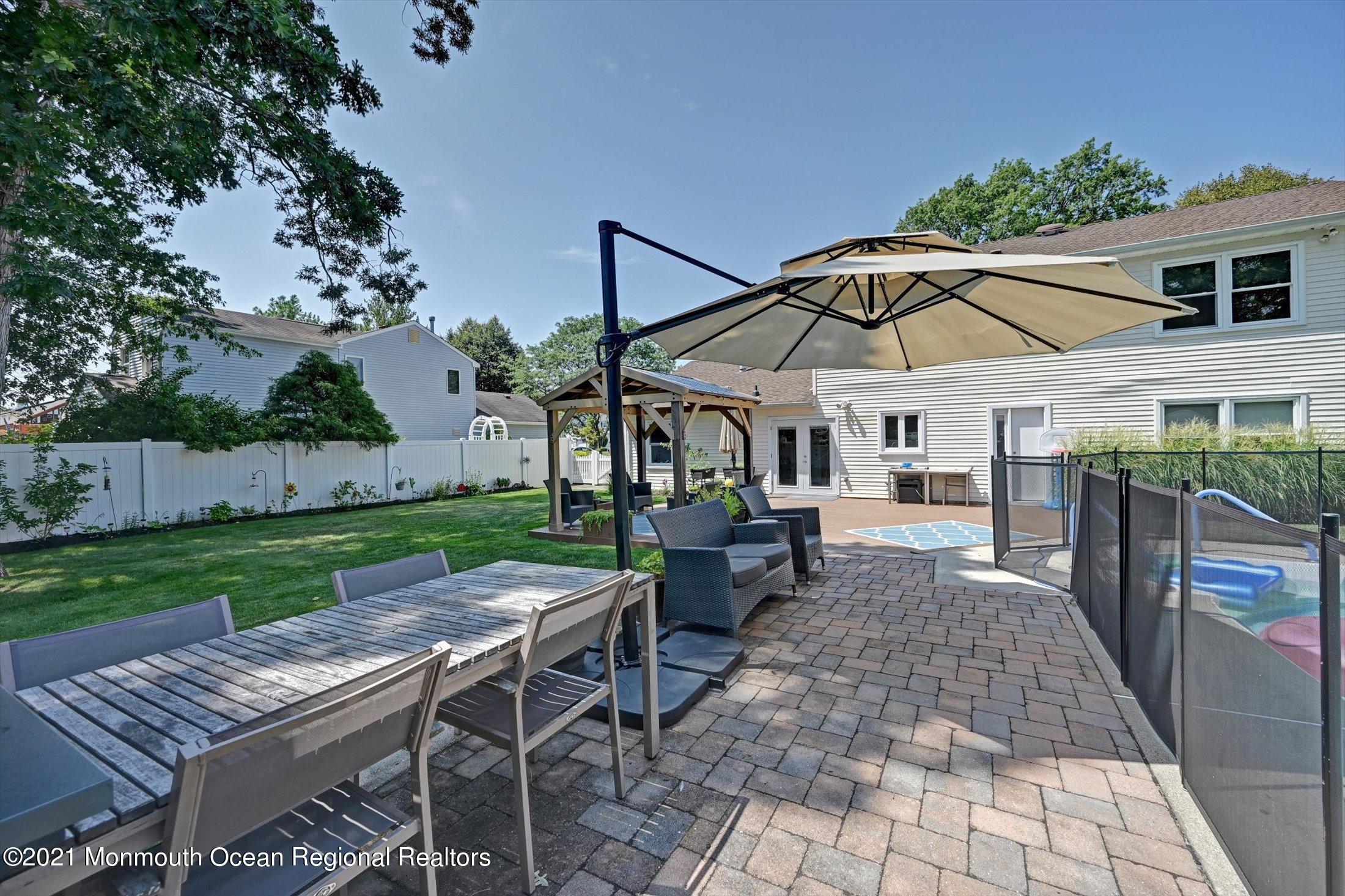 19 Regal Road Manalapan, NJ 07726 - Photo 29 of 33 Paver Lounge Area