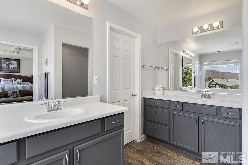 2267 Big Trail Circle Reno, NV 89521 - Photo 23 of 37 a bathroom with a sink double vanity granite and a mirror