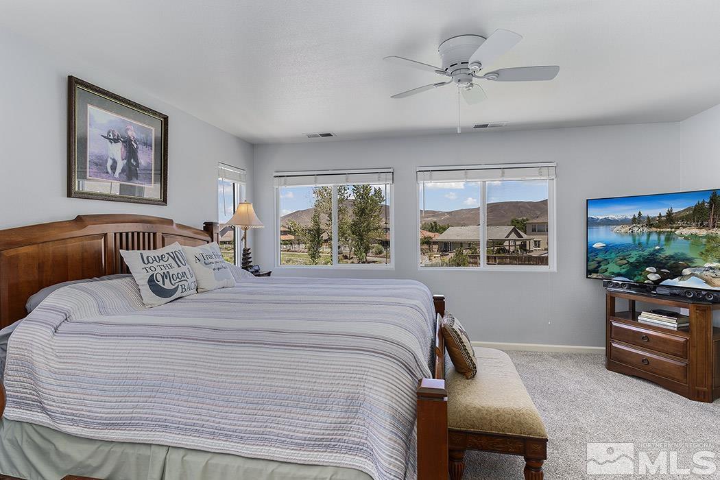2267 Big Trail Circle Reno, NV 89521 - Photo 25 of 37 a bedroom with a large bed and a window