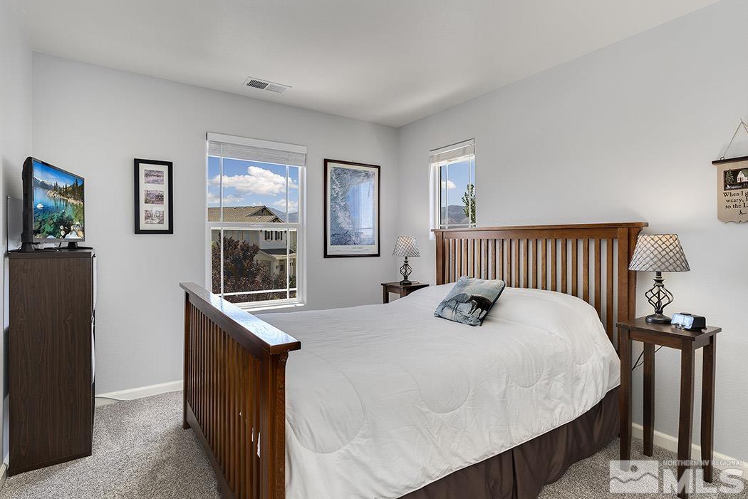 2267 Big Trail Circle Reno, NV 89521 - Photo 26 of 37 a bedroom with a bed and a flat screen tv