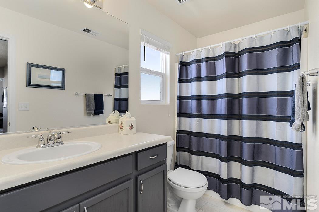 2267 Big Trail Circle Reno, NV 89521 - Photo 28 of 37 a bathroom with a sink a toilet and shower