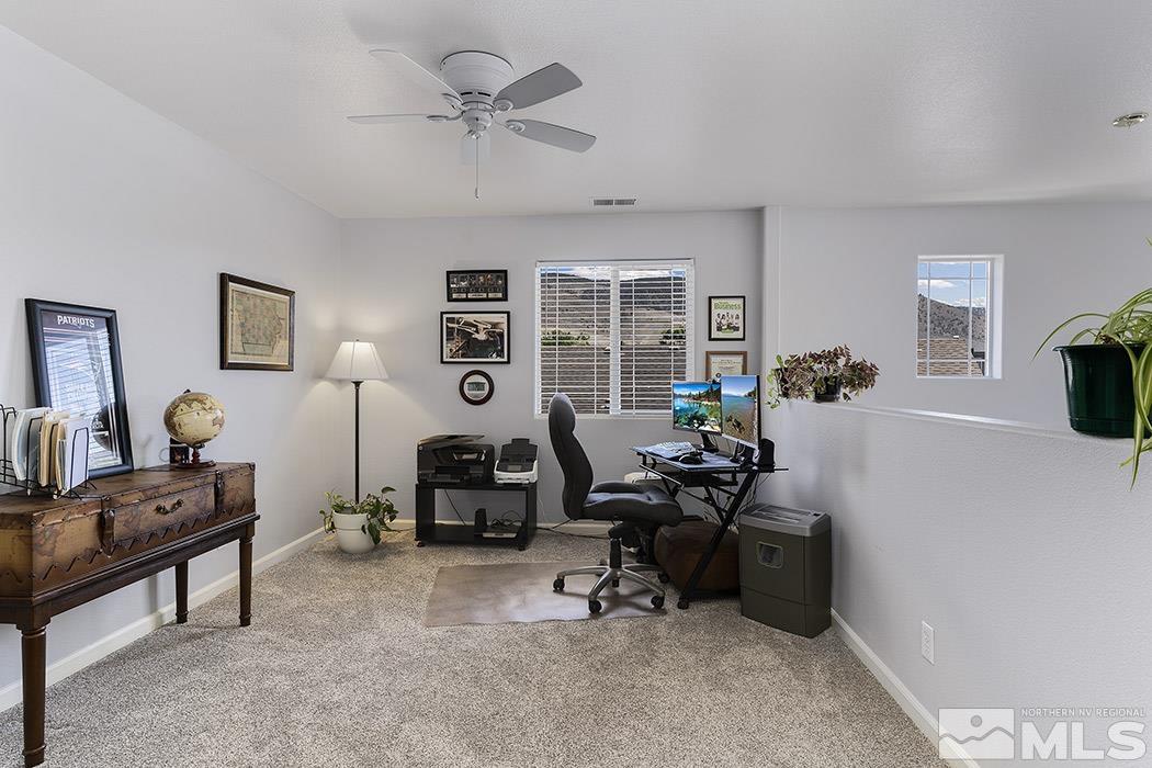 2267 Big Trail Circle Reno, NV 89521 - Photo 29 of 37 a living room with furniture gym equipment and a large window