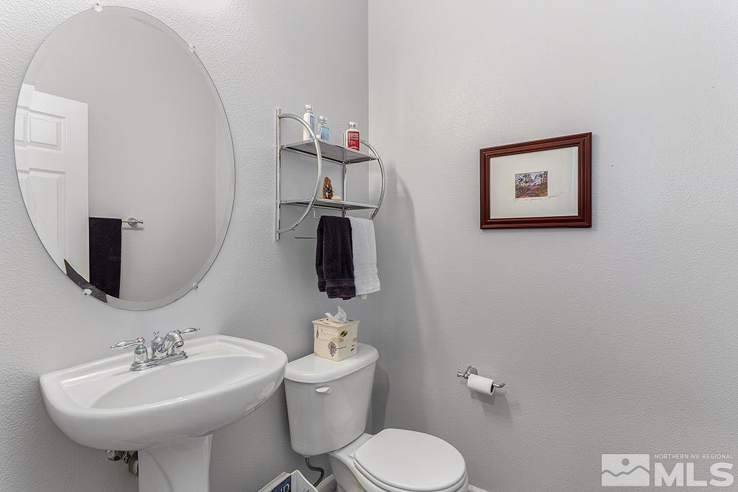 2267 Big Trail Circle Reno, NV 89521 - Photo 32 of 37 a bathroom with a toilet sink and mirror
