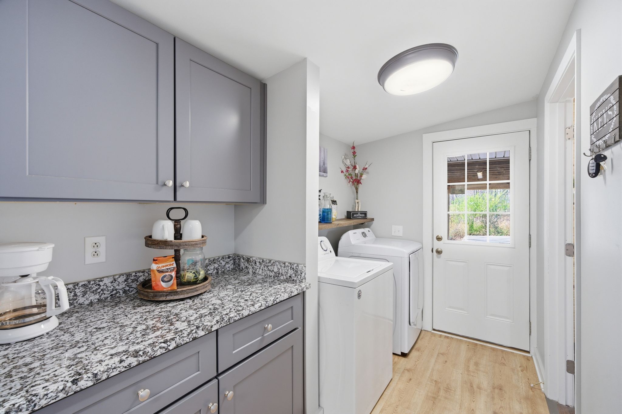 1225 Eno Road Dickson, TN 37055 - Photo 12 of 25 a kitchen with a sink cabinets and wooden floor