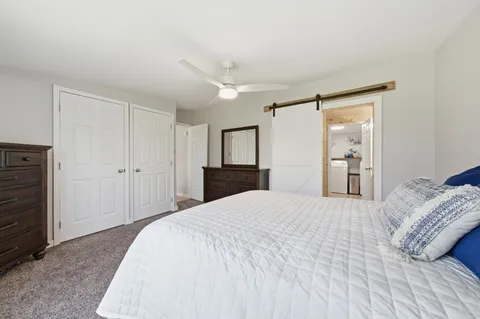 a bedroom with a bed and a closet