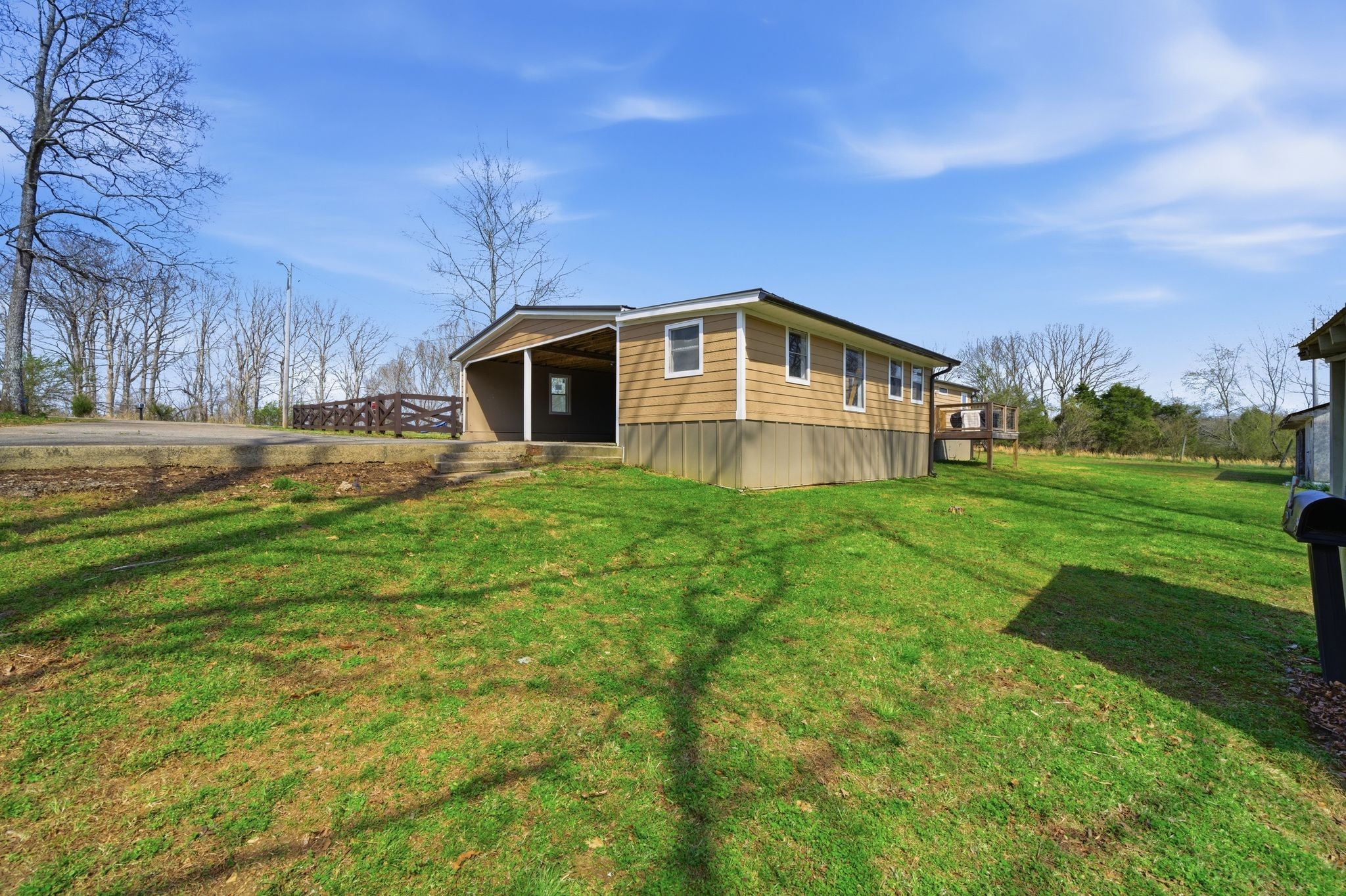 1225 Eno Road Dickson, TN 37055 - Photo 22 of 25 a front view of a house with yard and green space