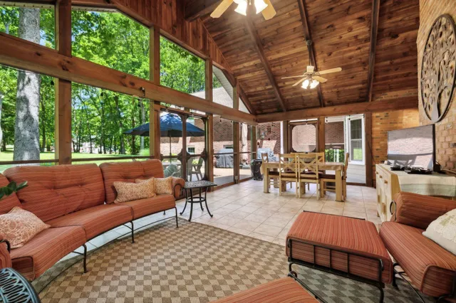a outdoor living space with furniture and a large window