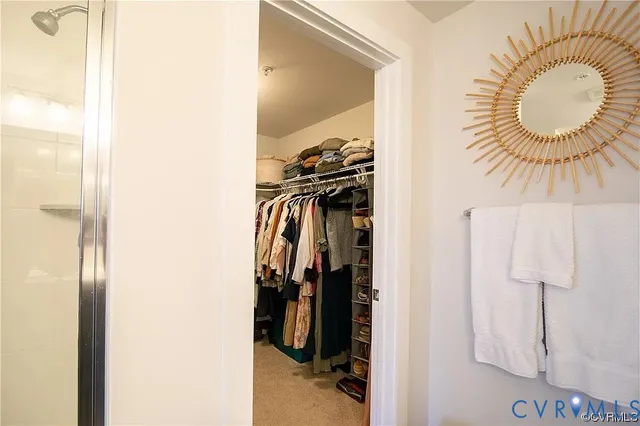 a view of a closet and a mirror