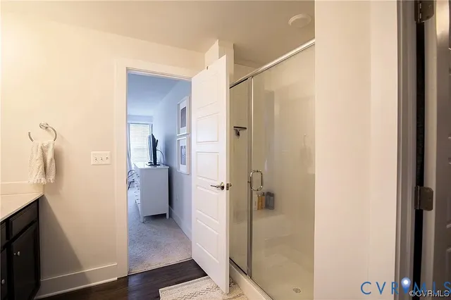 a bathroom with a shower and a sink