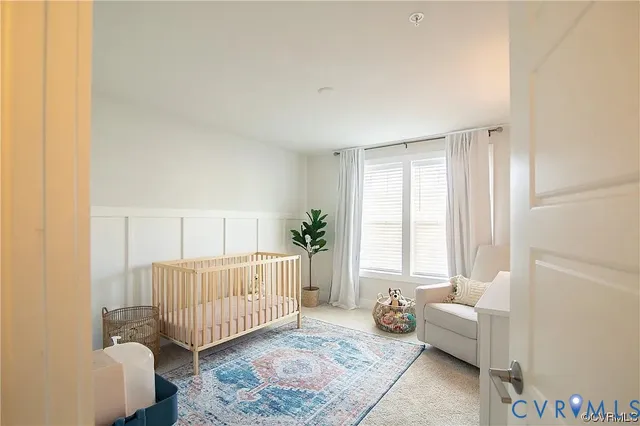 a living room with a couch and a window