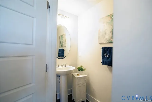 a bathroom with a sink and mirror