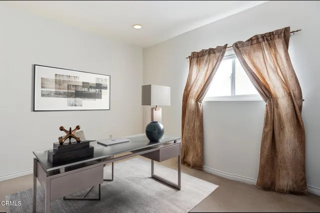 a living room with a couch and a window