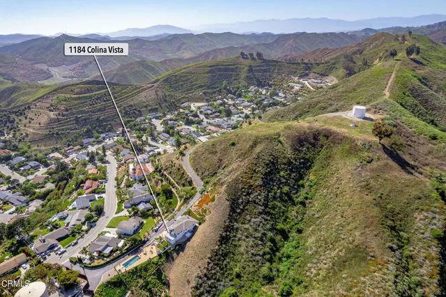 a view of a street with a mountain