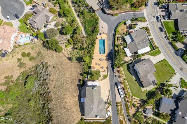 an aerial view of a residential apartment building with yard