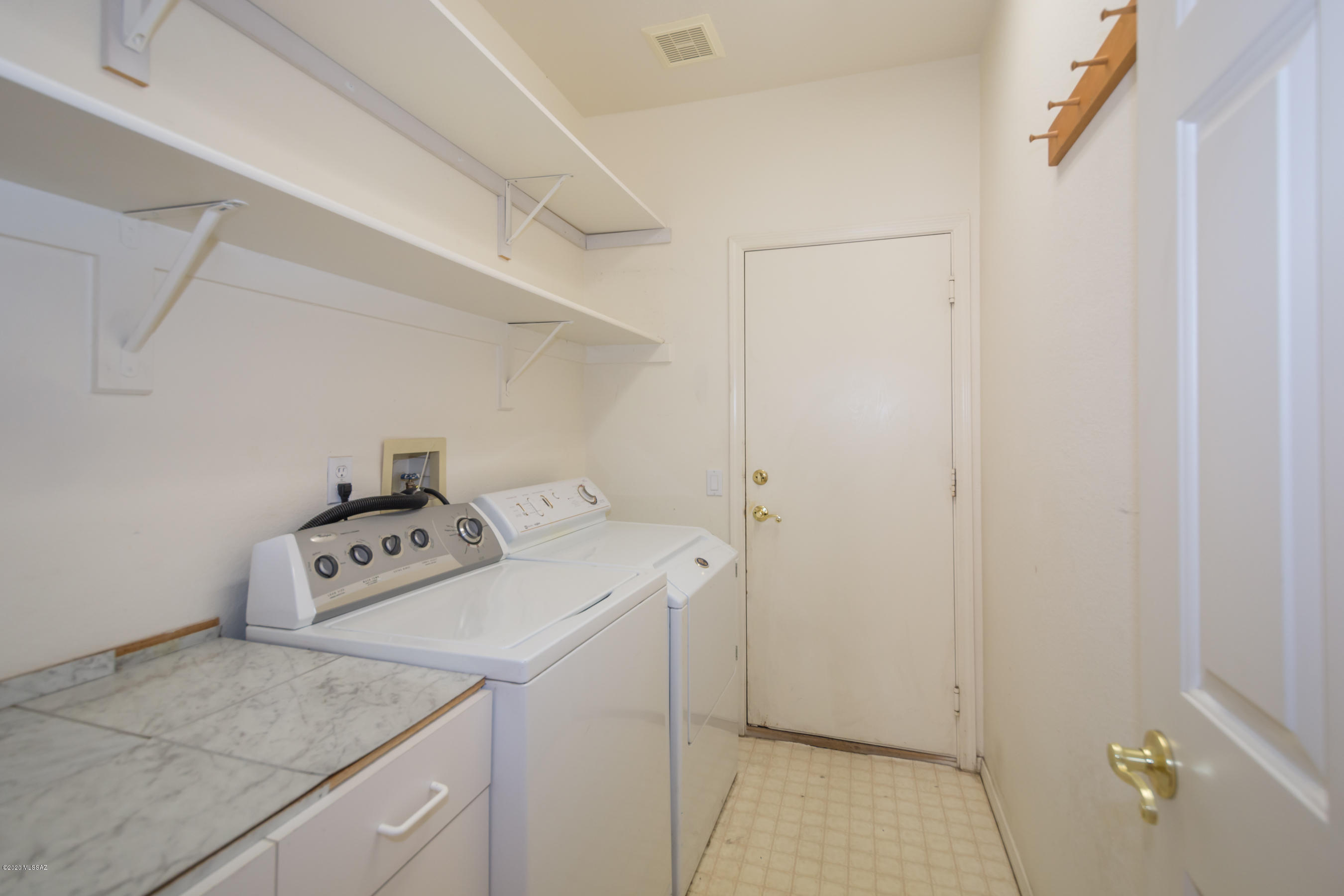 11341 Silver Pheasant Loop Oro Valley, AZ 85737 - Photo 41 of 41 a utility room with dryer and washer
