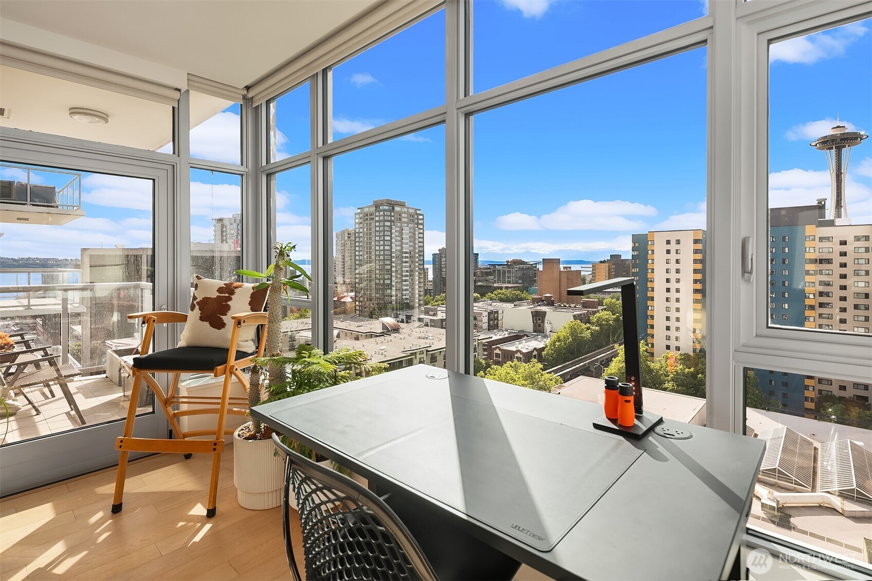 583 Battery Street, Unit 1405N Seattle, WA 98121 - Photo 2 of 37 a view of a living room with furniture and a floor to ceiling window