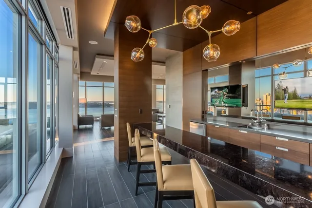 a very nice looking dining room with a large window