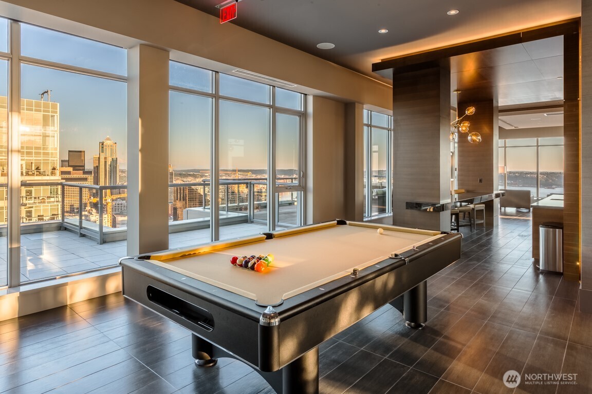 583 Battery Street, Unit 1405N Seattle, WA 98121 - Photo 27 of 37 a room with pool table and windows