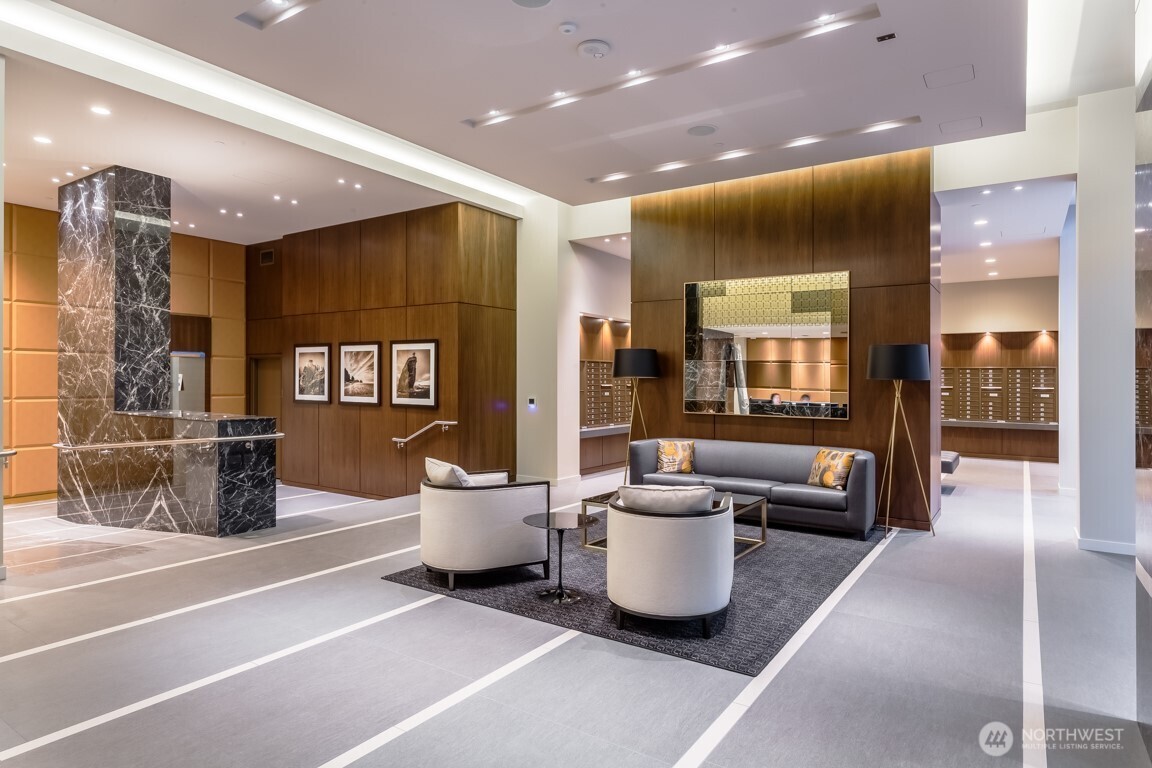 583 Battery Street, Unit 1405N Seattle, WA 98121 - Photo 35 of 37 a lobby with a couch and chairs