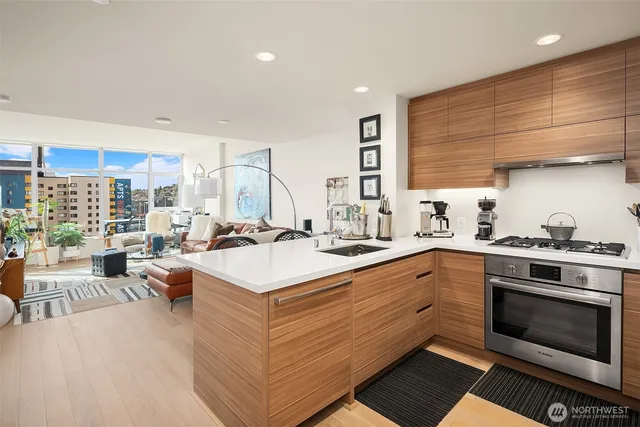 a kitchen with a stove a sink and a refrigerator