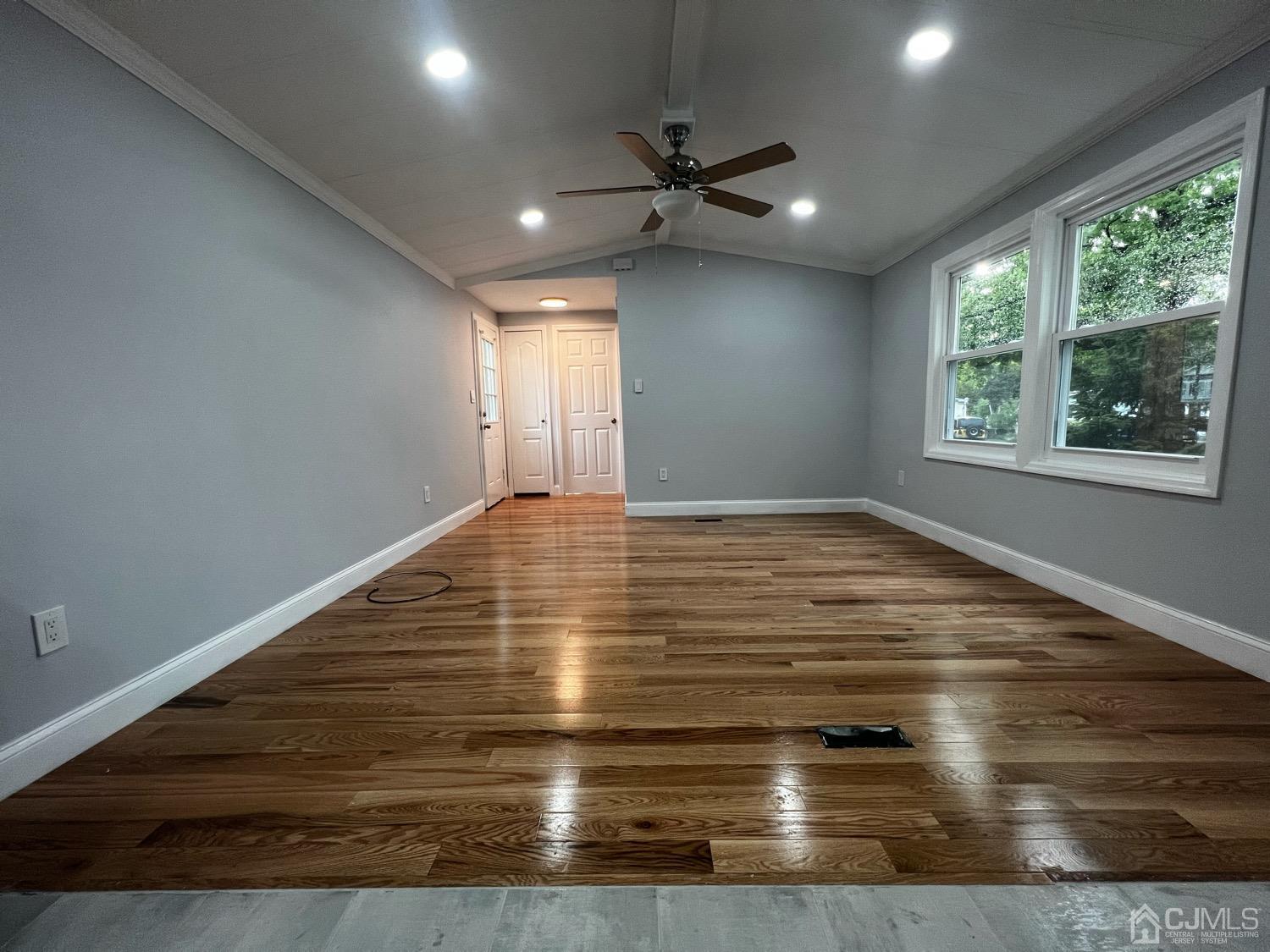24 Emerson Road North Brunswick, NJ 08902 - Photo 9 of 19 a view of empty room with wooden floor and fan