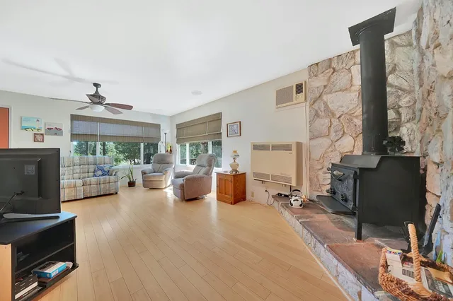 a view of a livingroom with furniture and a flat screen tv