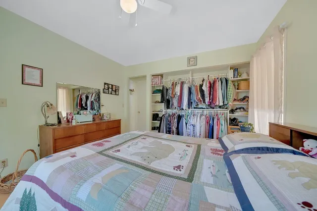 a bed room with a bed and a walk in closet