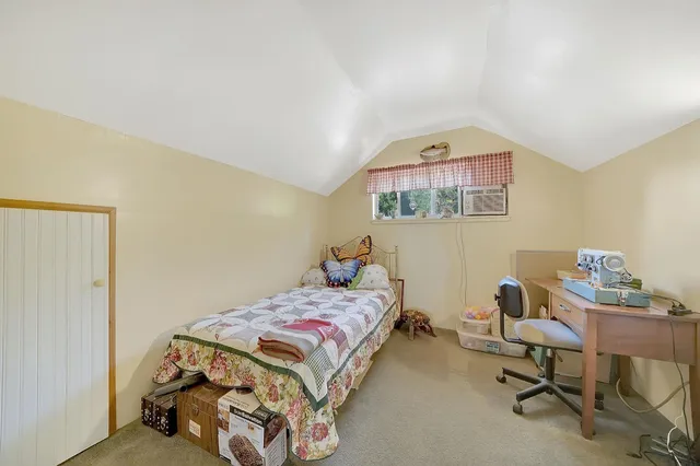 a view of a livingroom with furniture and hardwood floor