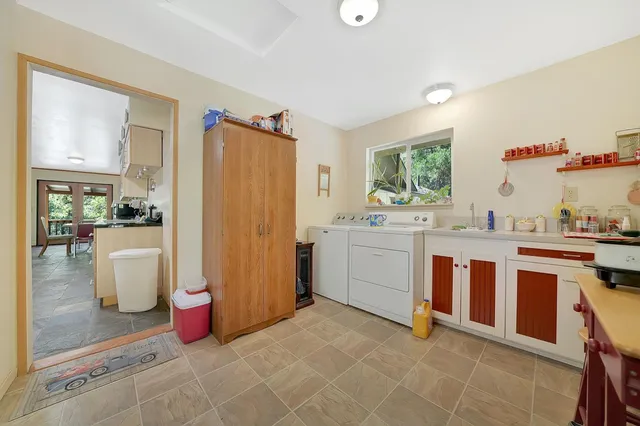 a view of an chairs and table in a room