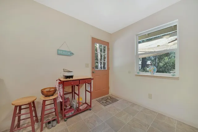 a kitchen with stainless steel appliances a refrigerator and a stove top oven