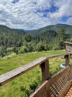 46 Busch Road Trail, OR 97541 - Photo 51 of 55 a view of a green field with an ocean view