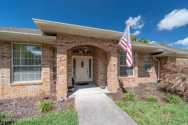 a view of a chairs and table in the patio