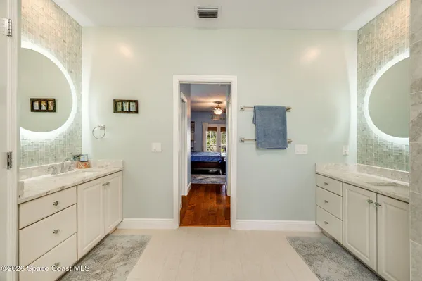 a bed room with a bed and a television