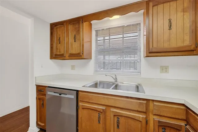a bathroom with a sink and a window