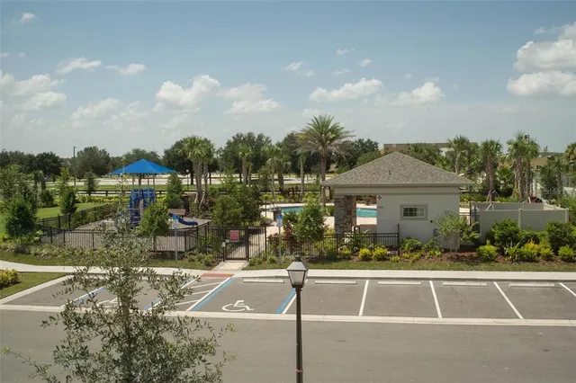 a view of a house with yard and sitting area